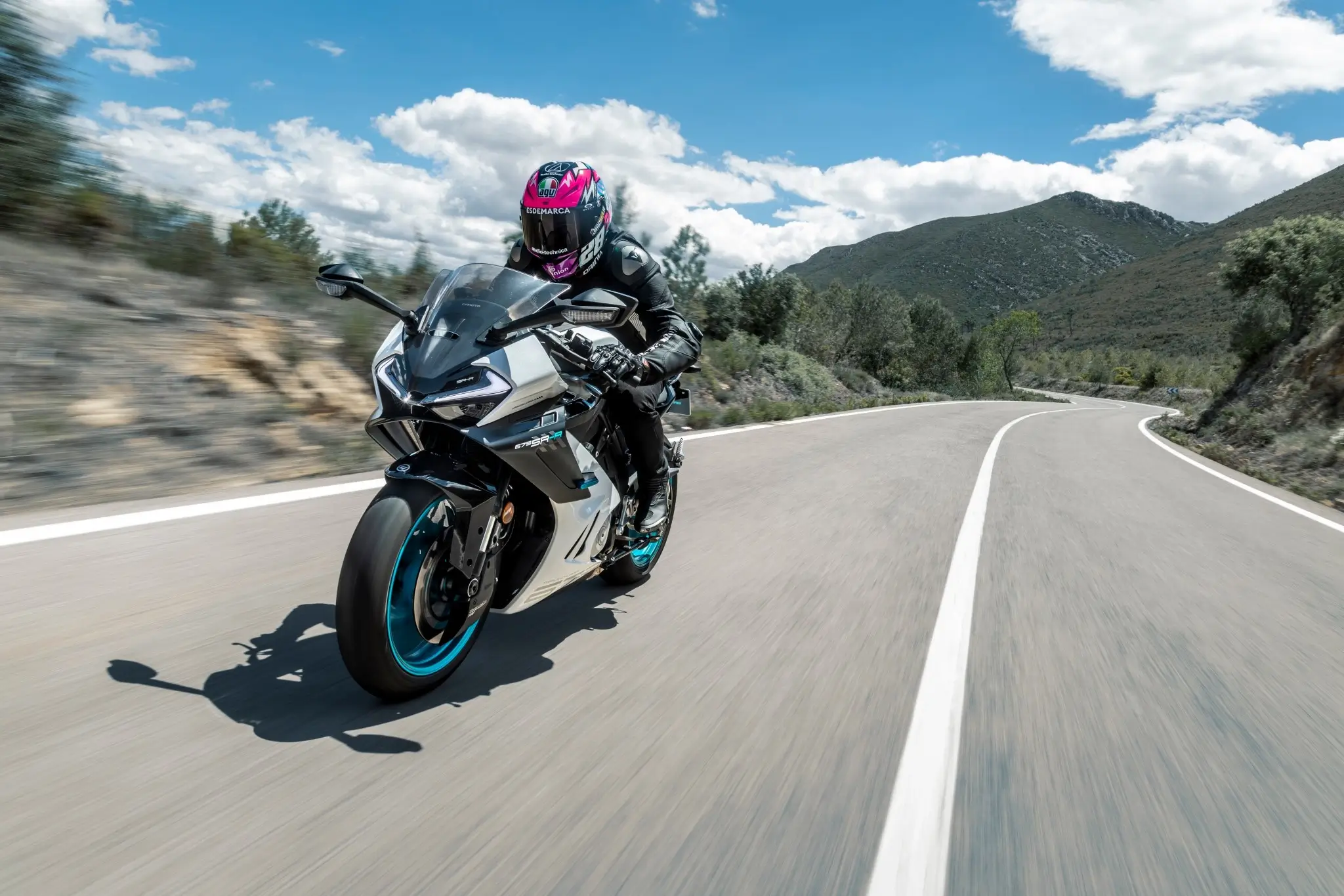 CFMOTO 675SR-R Aerolite Grey riding mountain road