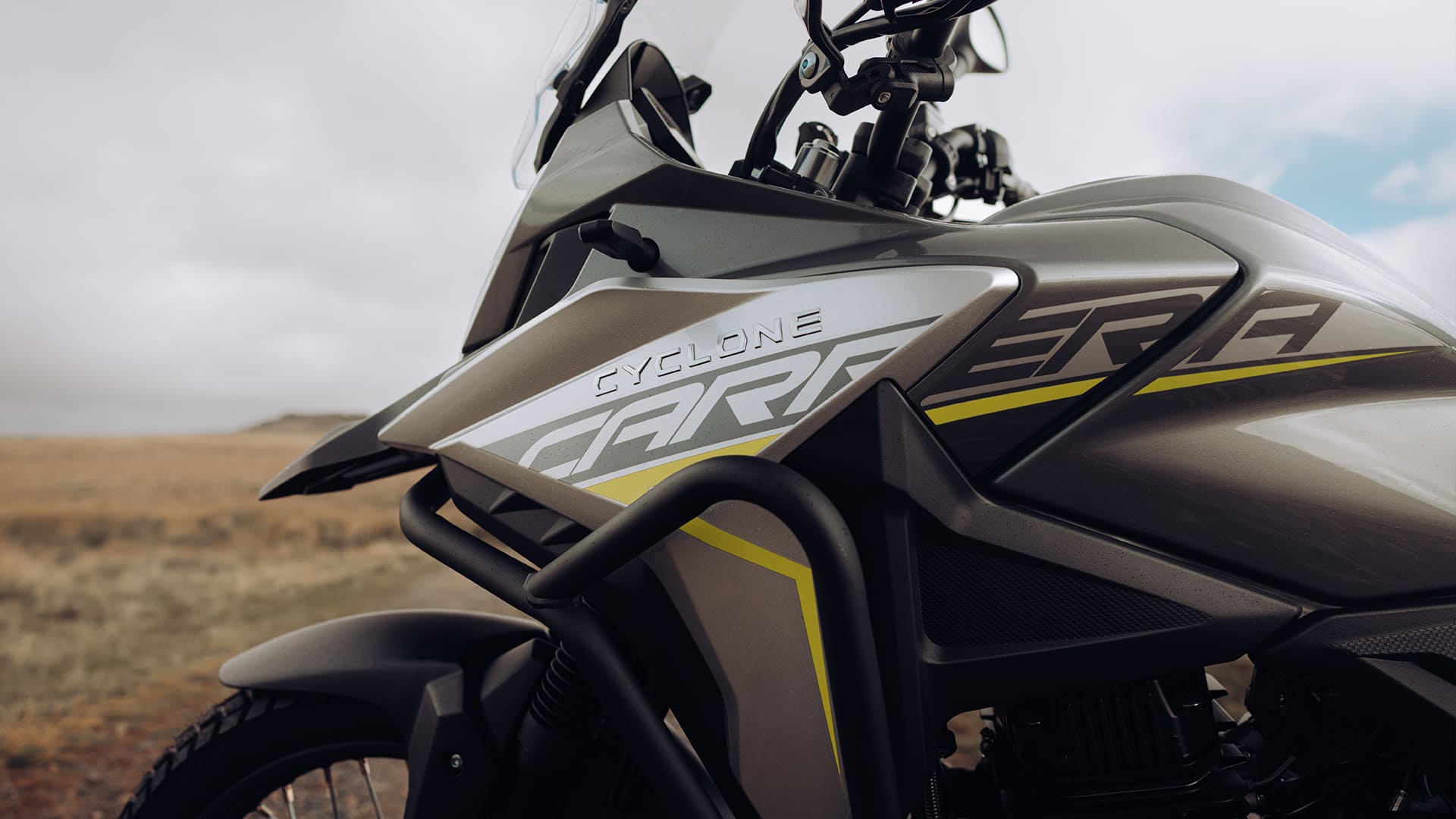 Cyclone Carrera tank branding and crash bars close-up