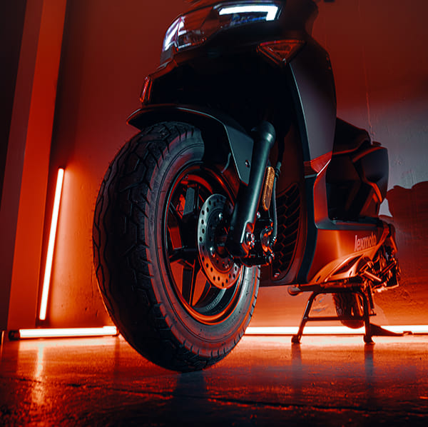 L5 front wheel and disc brake low angle with red neon glow