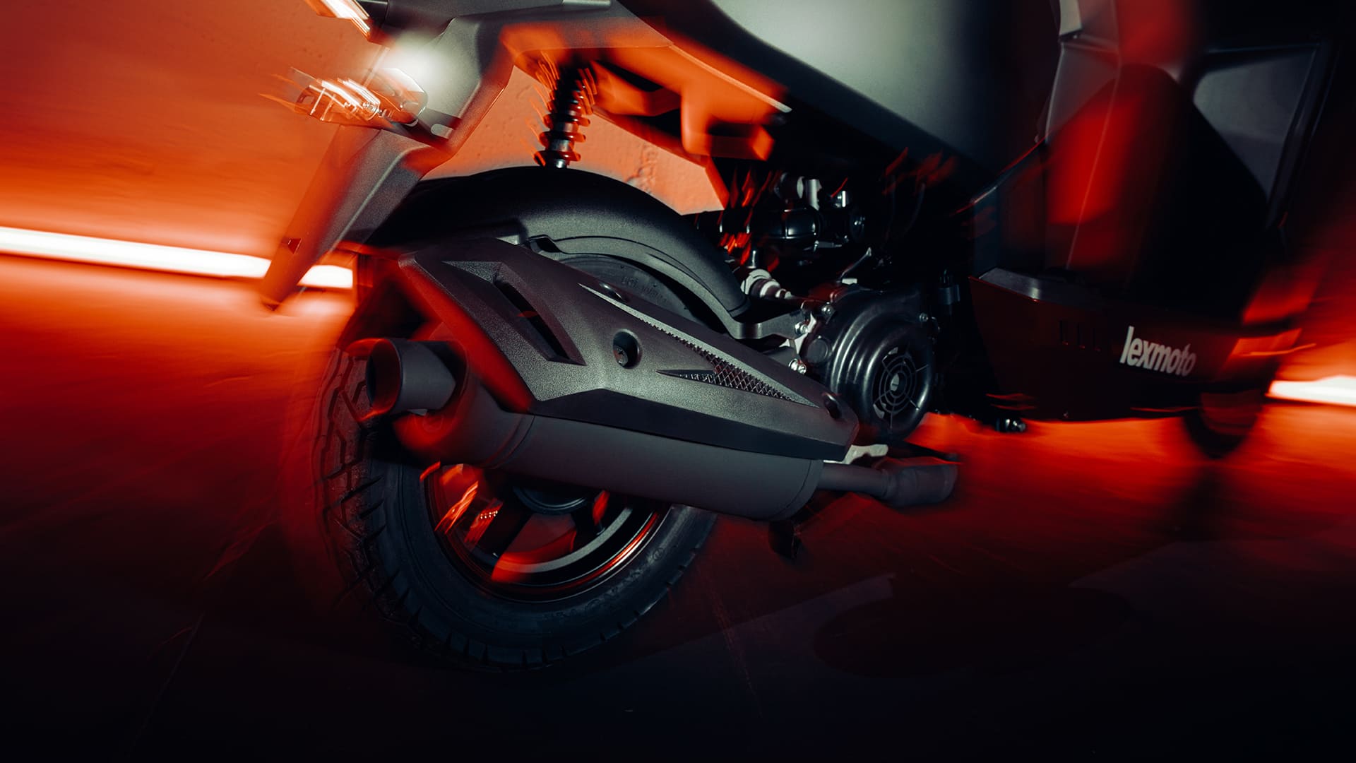 L5 rear wheel, exhaust, and CVT cover close-up with neon