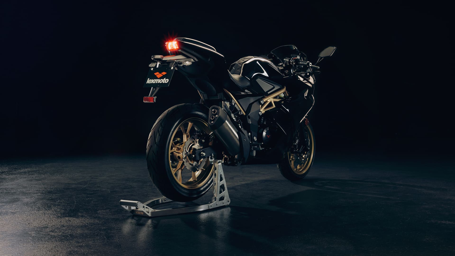 LXR 125 Black/Gold rear view on paddock stand