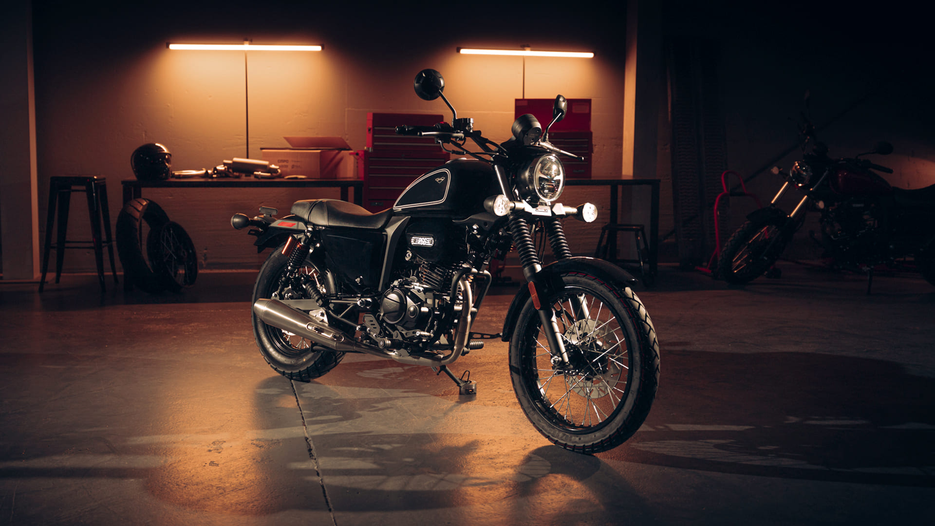 R66 Black front view in garage with spoke wheels