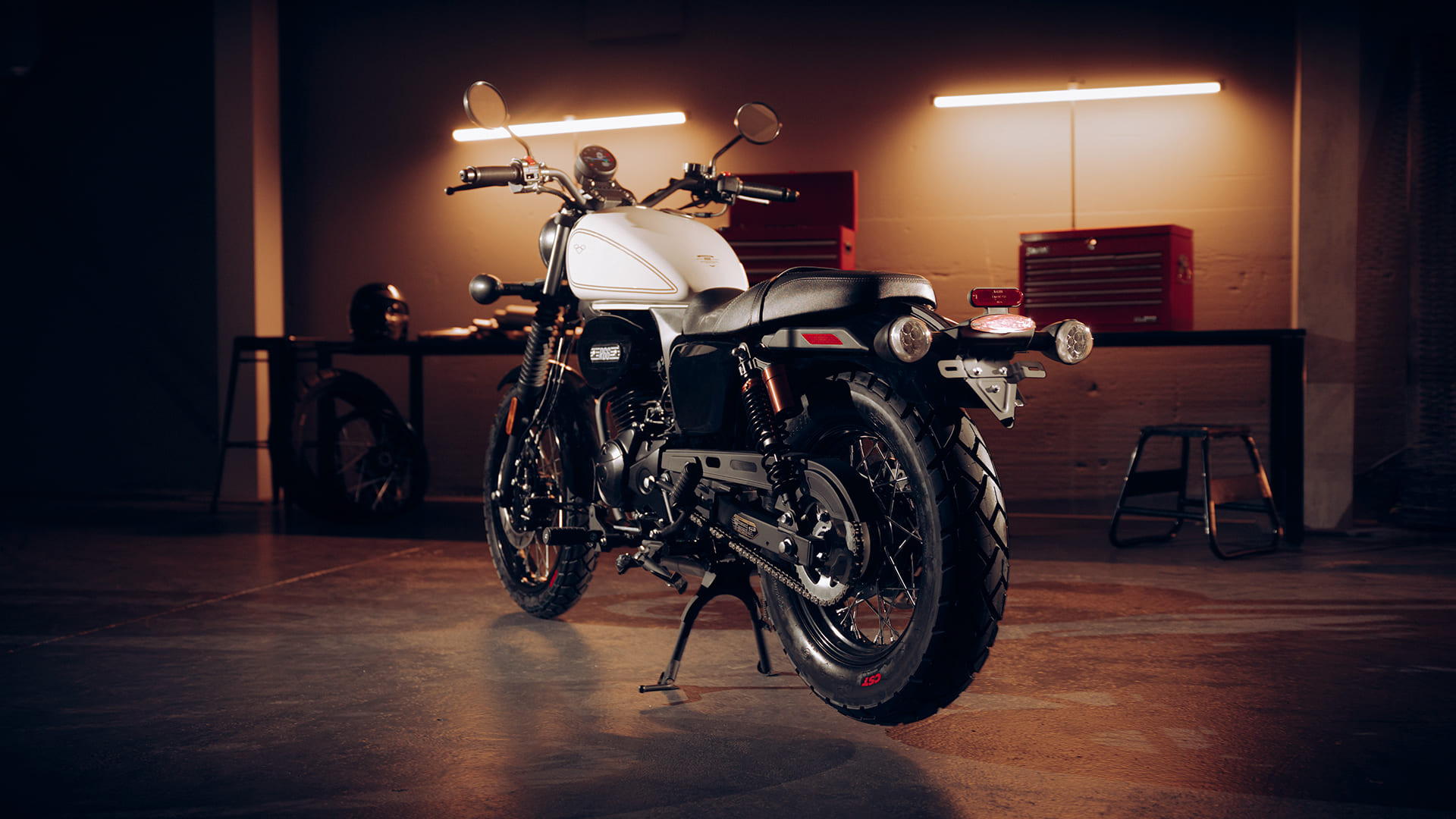 R66 Ivory rear three-quarter showing round indicators and chunky tyre