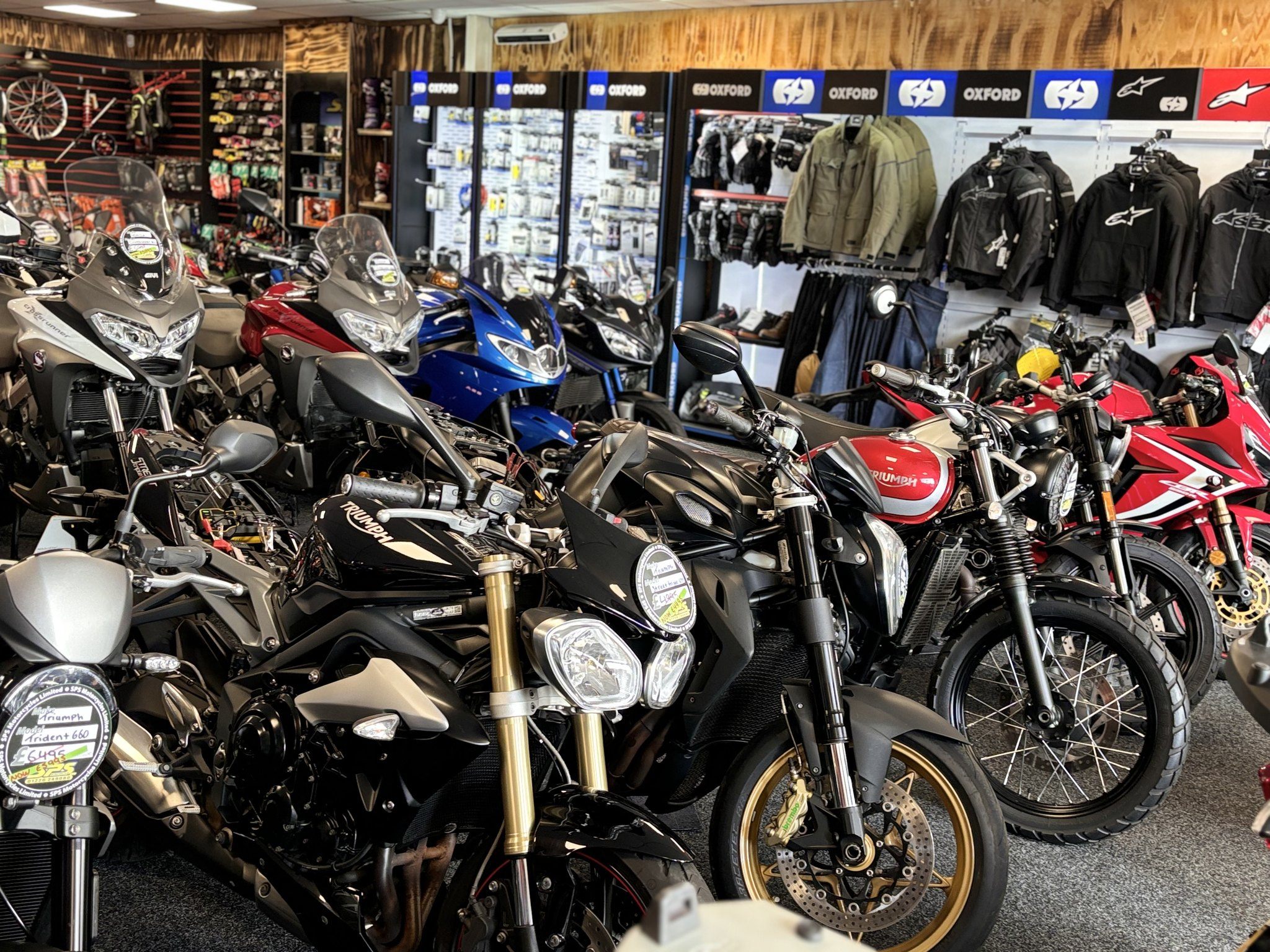 SPS Motorcycles showroom floor with Triumph and other motorcycles on display
